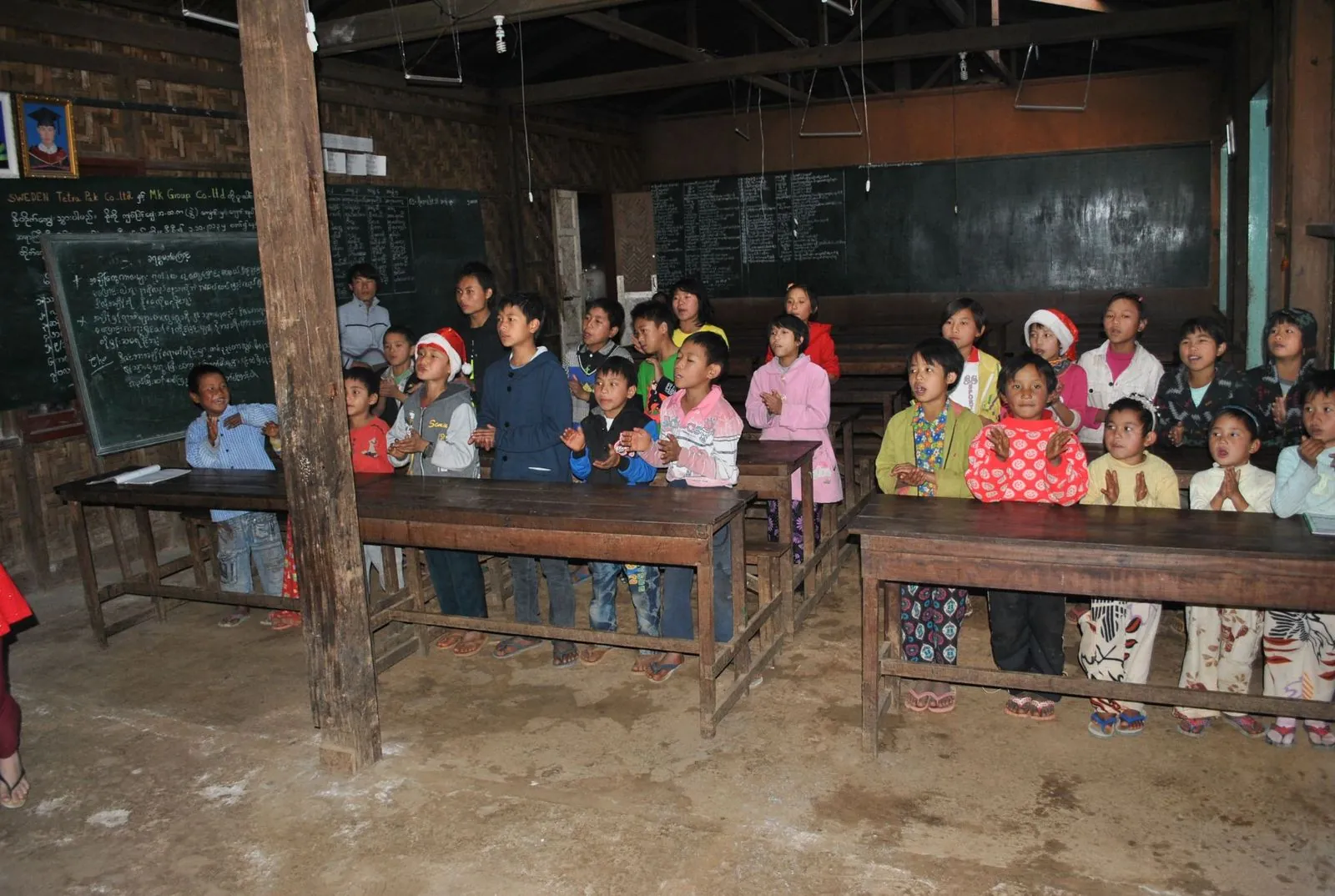 Children in a village school classroom in Myanmar